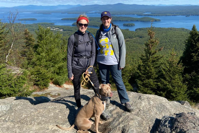 A drawing by a pre-k student of two hearts and a hand