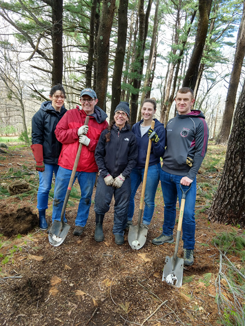 A drawing by a pre-k student of two hearts and a hand