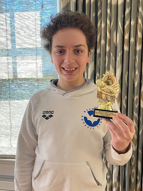 A drawing by a pre-k student of two hearts and a hand